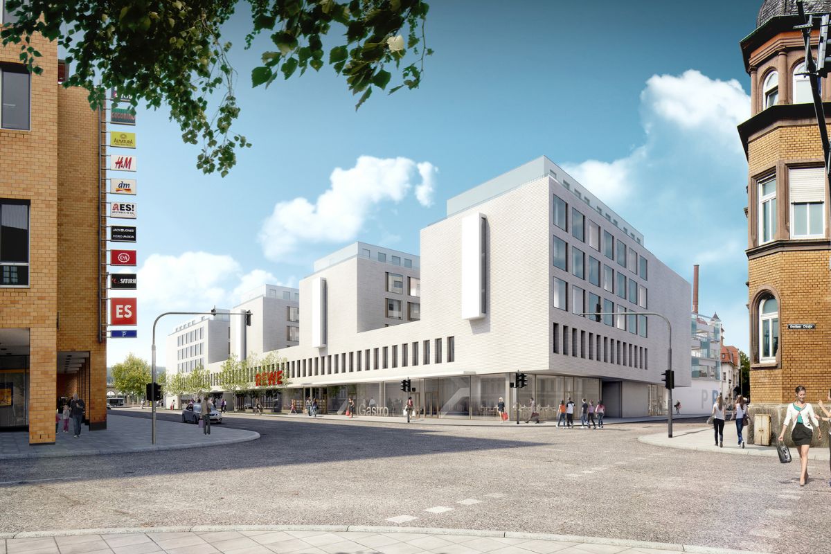 Blick auf das neue QBUS-Gebäude mit der sanierten Berliner Straße Blick auf das neue QBUS-Gebäude, davor die sanierte Berliner Straße und links das Einkaufszentrum ES