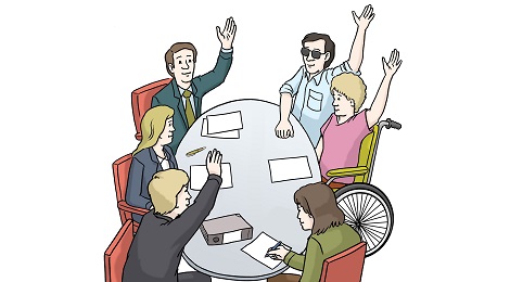 Menschen mit und ohne Behinderung sitzen an einem Tisch und stimmen ab ©St