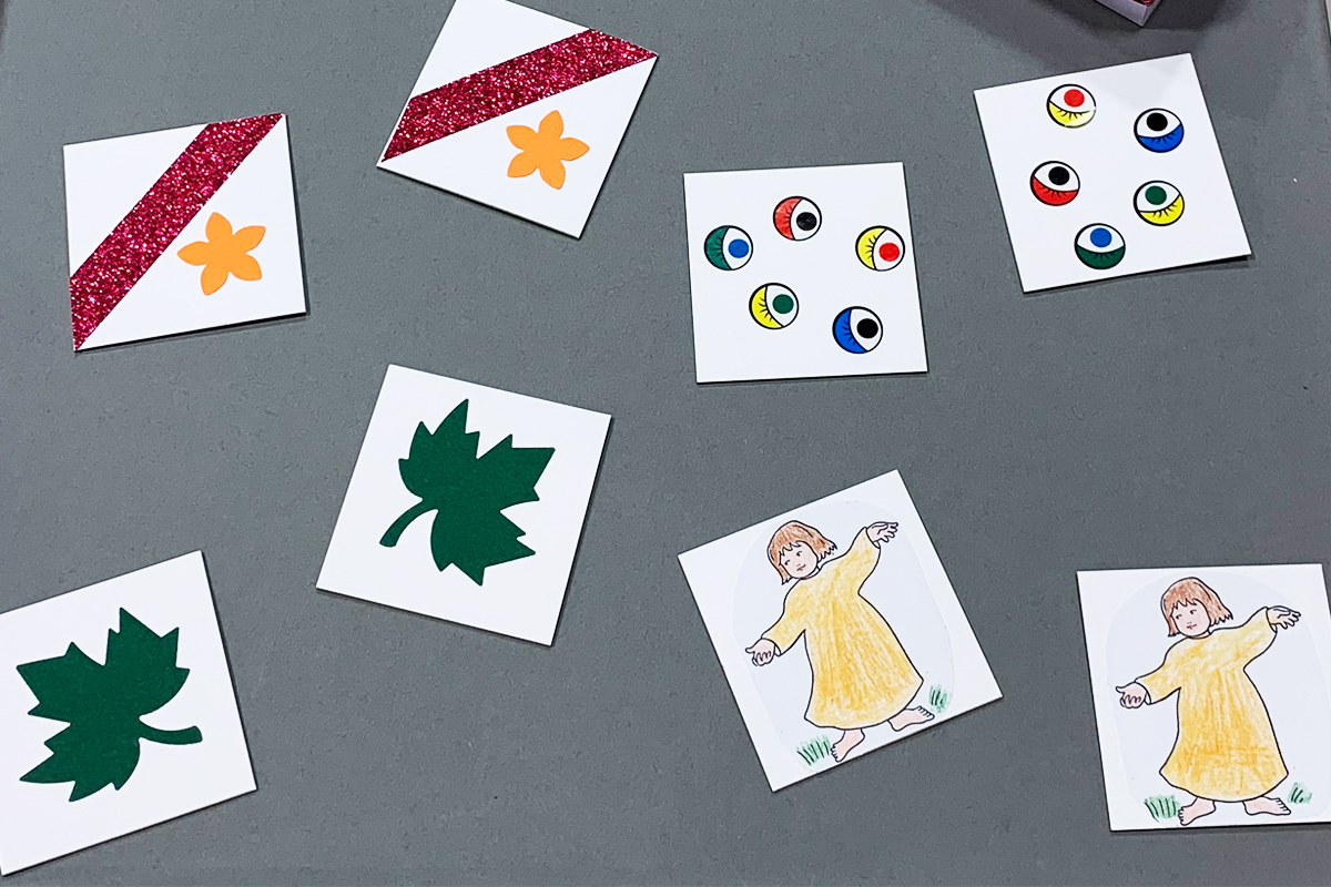 Gedächtnisspiel mit mehreren Bildkarten, davon jeweils zwei identisch gestaltet.